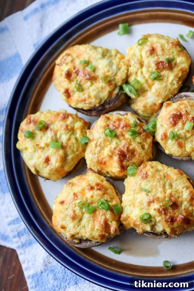 Close-up of Curry Crab Stuffed Mushrooms, showcasing the rich, creamy filling and tender mushroom cap. Irresistible party food.