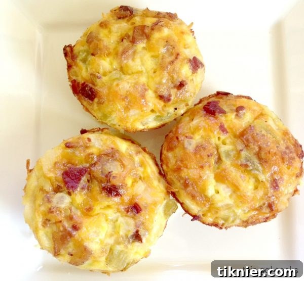 A close-up of golden-brown Mini Bacon & Egg Casseroles, ready to be served.