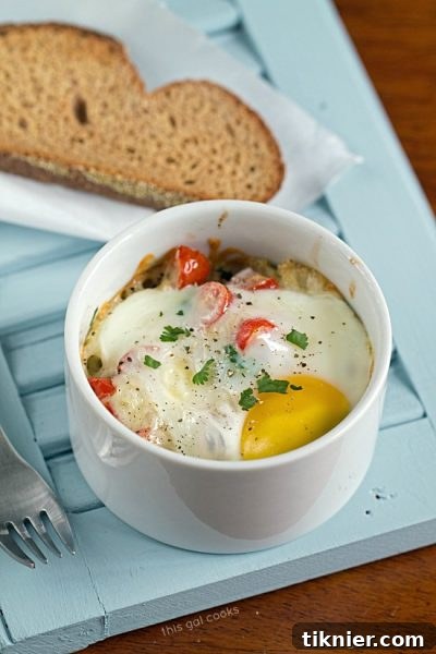 Baked Eggs with Quinoa and Fresh Salsa - A fresh, healthy breakfast option, packed with protein, veggies and grains, from This Gal Cooks.