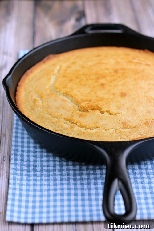 Close-up of a slice of moist Cast Iron Buttermilk Cornbread, perfect for pairing with any meal.