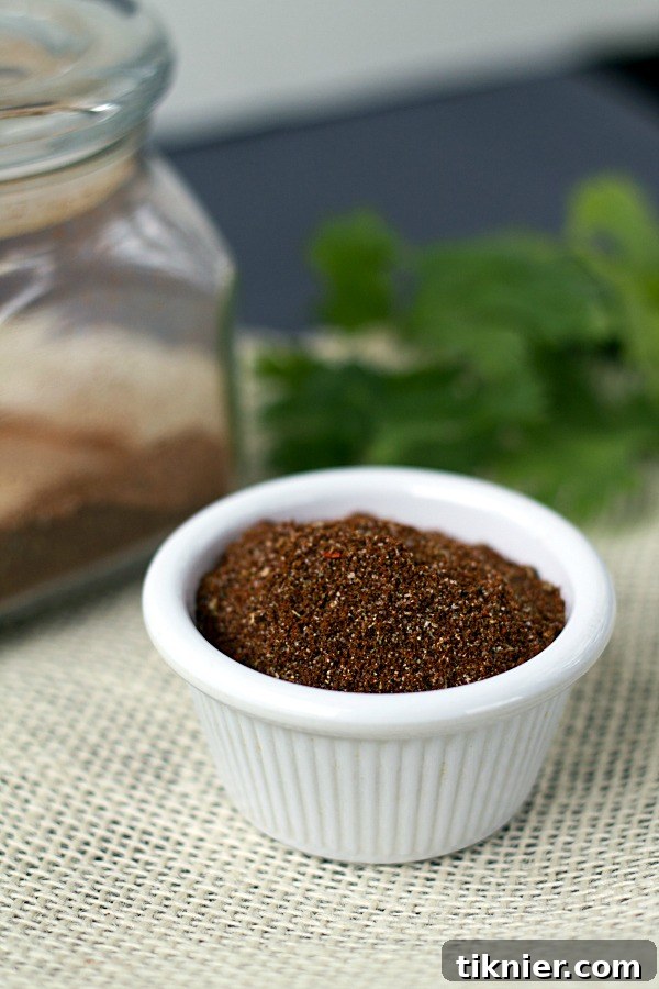 Homemade Taco Seasoning in a small bowl with a spoon, ready to be sprinkled on your favorite dishes.
