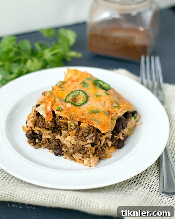 Tex-Mex Lasagna 4 Delicious layers of Taco Lasagna, showcasing the rich cheese and savory fillings.