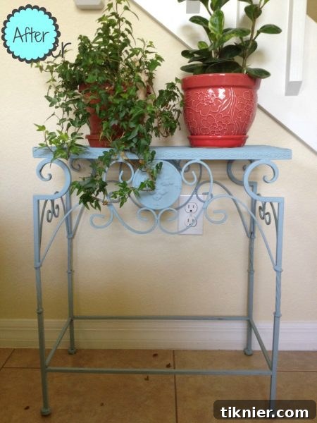 After: A beautifully repainted metal plant stand in a custom coastal blue, finished with clear wax.