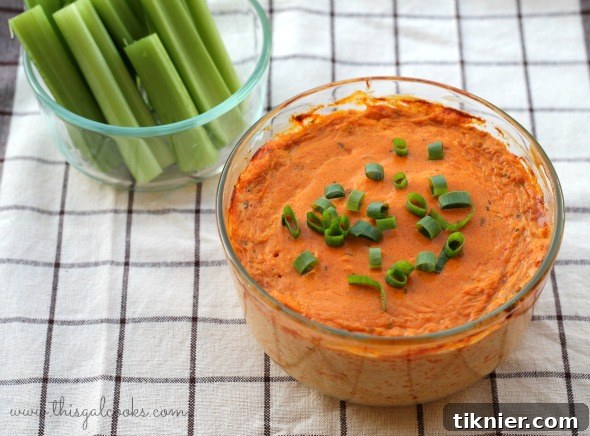 Close-up of creamy Buffalo Chicken Dip, ready for scooping.