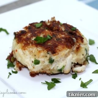 Delicious Homemade Crab Cakes with Sweet Chili Lime Sauce, ready to be served on a platter.