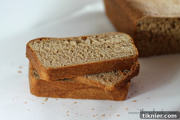Rustic 100% Whole Wheat Bread - A close-up of a perfectly baked loaf, highlighting its texture.