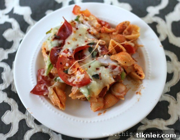 Serving Cheesy Pizza Pasta Casserole