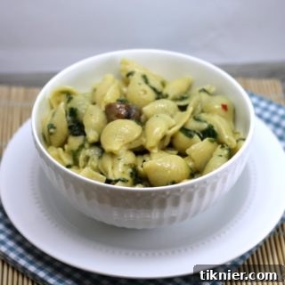 Simple Spinach and Sausage Pasta recipe card image, featuring the finished dish in a bowl.