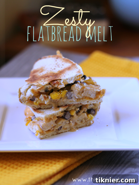 Delicious Zesty Flatbread Melt with grilled chicken, corn, and black beans, ready to be enjoyed.