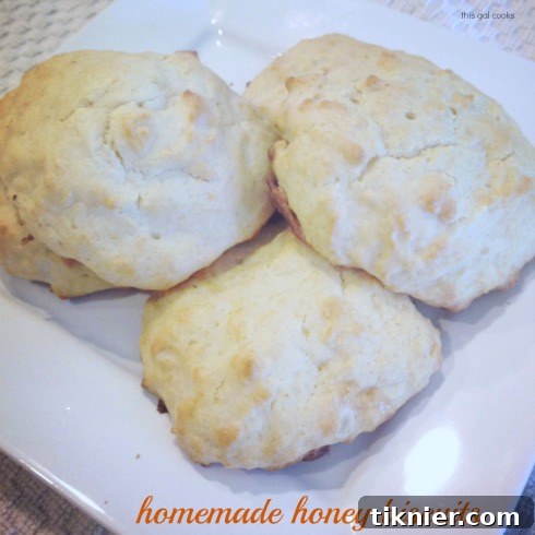 Fluffy homemade honey biscuits, warm and ready for breakfast.