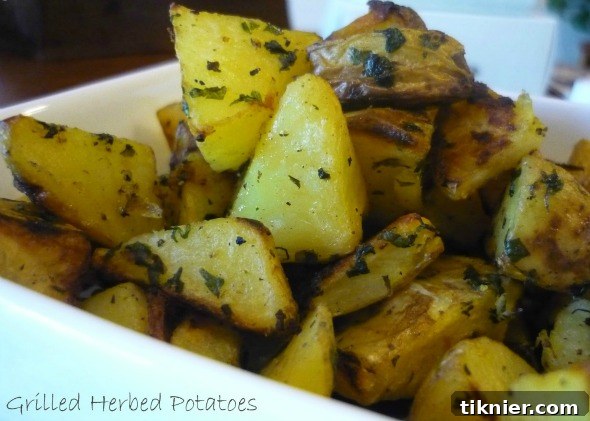 Grilled Herbed Potatoes, perfectly charred with fresh herbs