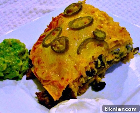 Taco Lasagna, a layered dish with taco meat, tortillas, and cheese.