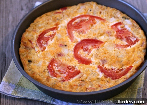 Close-up of the delicious Crustless Sausage & Veggie Quiche, highlighting its rich texture and ingredients.