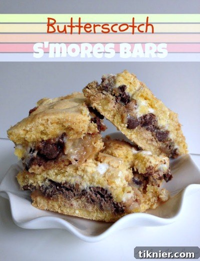 Chewy Butterscotch S'mores Bars, layered with graham crackers, gooey marshmallows, and a sweet butterscotch base, offering a delightful no-bake twist on a classic.