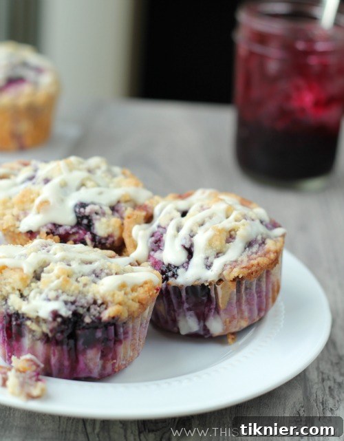 Blueberry Crumble Muffins 6 A platter of beautifully glazed Blueberry Coffee Cake Muffins, ready to be served. From www.thisgalcooks.com