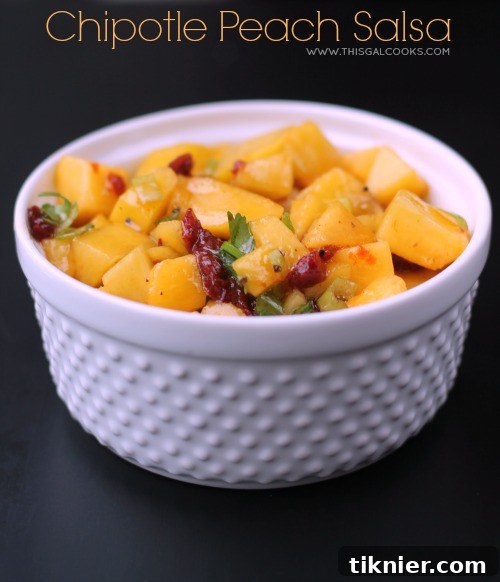 Close-up of freshly prepared Chipotle Peach Salsa in a bowl, showing texture and color.