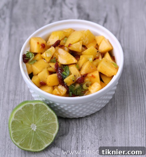 Chipotle Peach Salsa served with tortilla chips, ready for dipping.