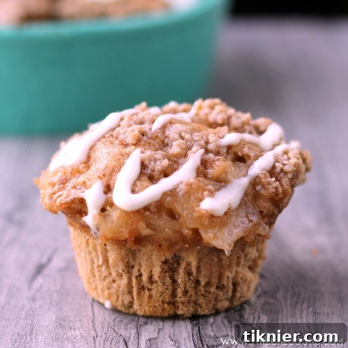 Easy to make Apple Spice Muffins are made using boxed spice cake mix and apple pie filling and topped with cream cheese icing. Perfect breakfast served with coffee!