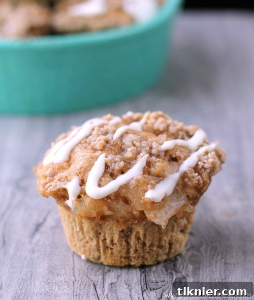 Apple Spice Muffins from www.thisgalcooks with a generous amount of cream cheese glaze