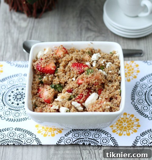 Colorful Strawberry Quinoa Salad with a light dressing, ideal for summer