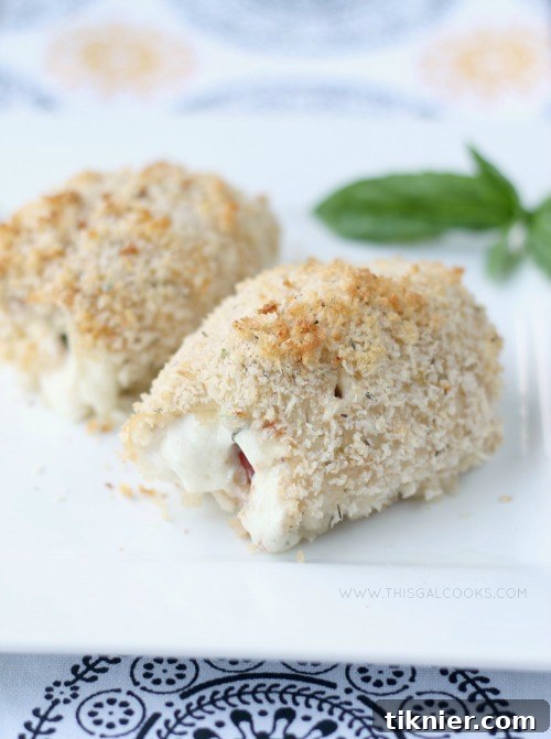 A beautifully plated Caprese Chicken Rollup, showcasing fresh ingredients and golden crust