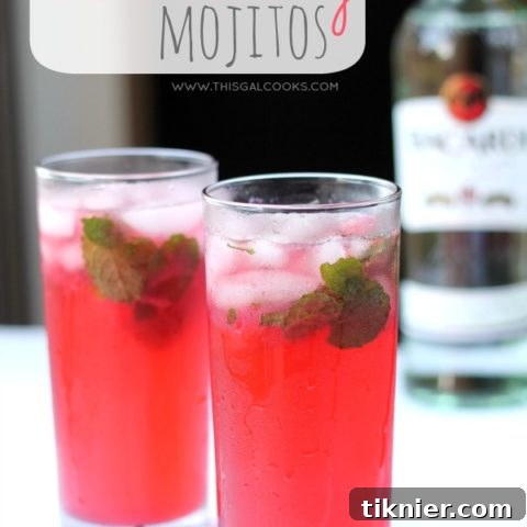 A vibrant and inviting image of a Blackberry Mojito, showcasing the rich color, fresh mint, lime, and whole blackberries within the glass, ready to be enjoyed.