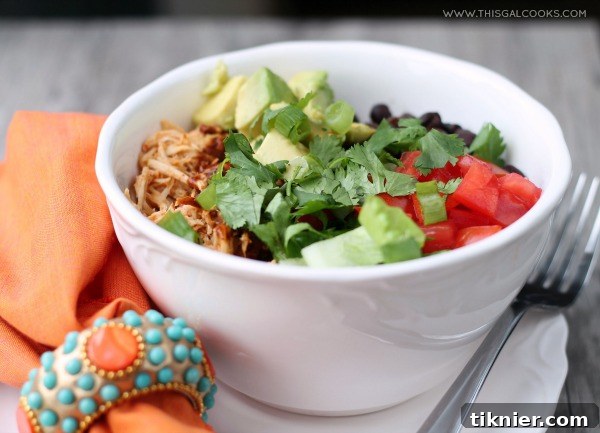 Slow Cooker Chicken Enchilada Rice Bowls from www.thisgalcooks.com. The chicken cooks in a #slowcooker, the rice in a rice cooker and all you have to do is make the sauce and prepare your toppings. A delicious craft beer infused meal.