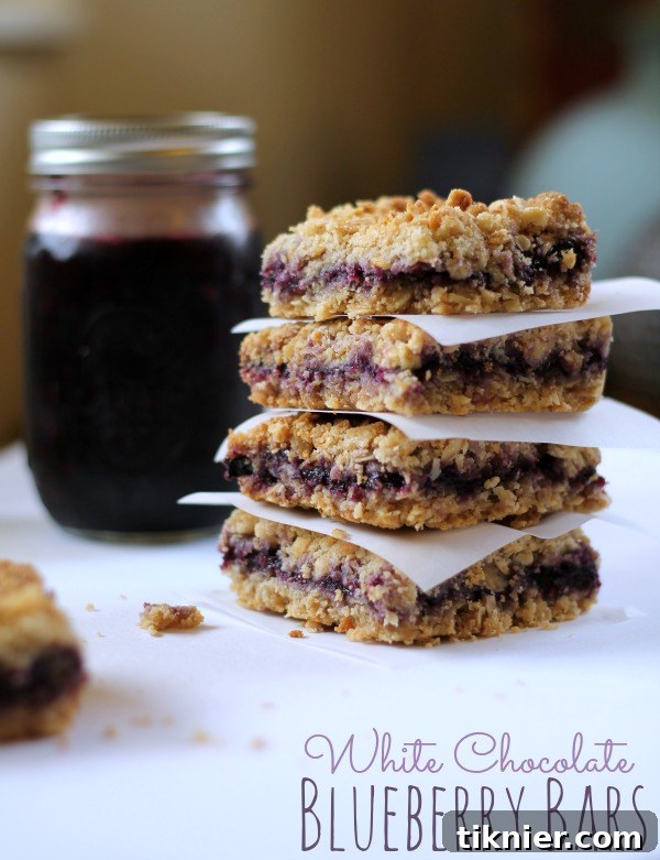 White Chocolate Blueberry Bars from www.thisgalcooks.com. Delicious oat bars with blueberries and white chocolate. #blueberries #oatbars