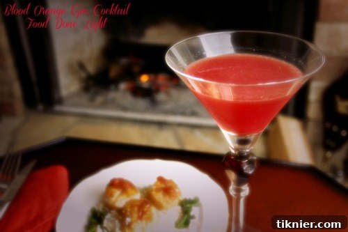 Deep red Blood Orange Gin Cocktail with orange slice