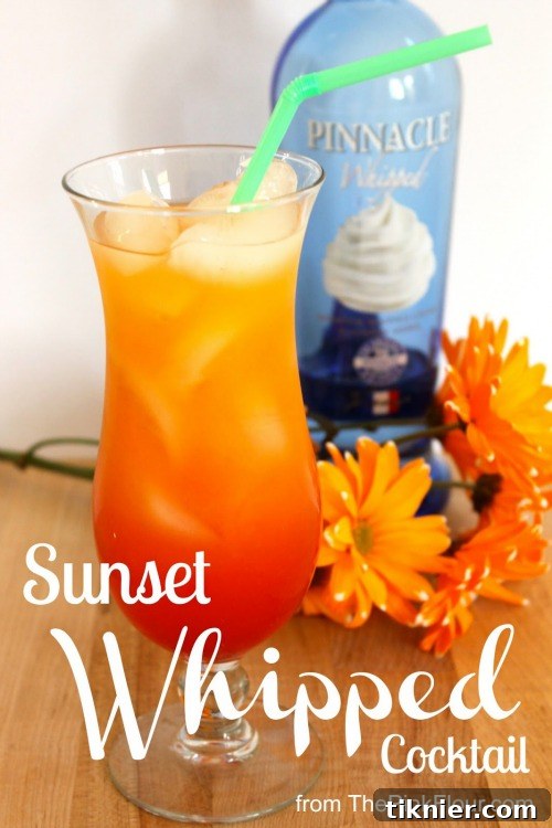 Vibrant Sunset Whipped Cocktail with citrus garnish