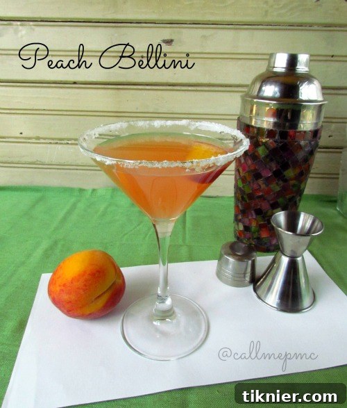 Elegant Peach Bellini Martini in a cocktail glass