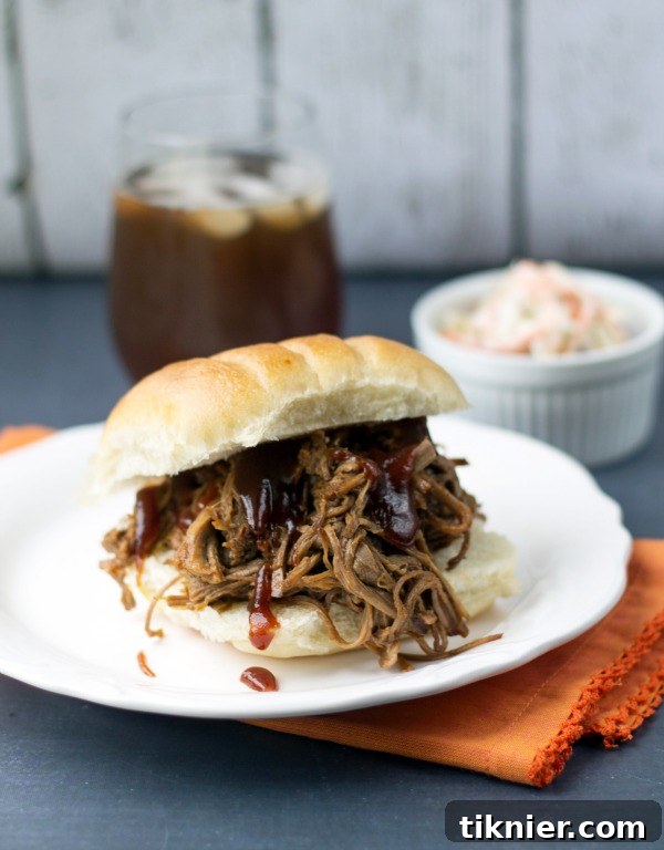 Juicy Crockpot BBQ Beef Sandwiches served on buns with fresh toppings