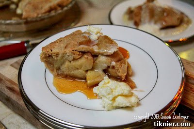 A rustic and inviting All American Pub Apple Pie, featuring a golden-brown crust and a tantalizing filling.