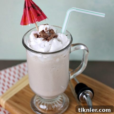 Bushwacker Cocktail, a creamy frozen drink with a dark rum float and whipped cream topping.