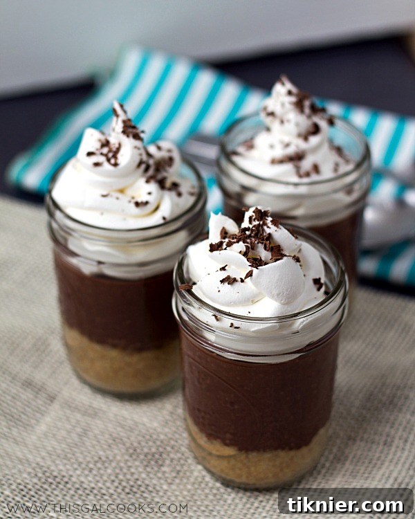 Individual Chocolate Pudding Pie in a Jar with whipped cream and chocolate shavings from www.thisgalcooks.com. Perfect for easy, no-bake desserts and jar recipes.