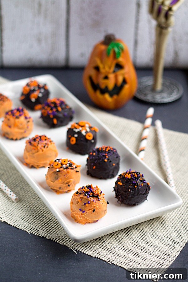 Close-up of three Halloween Brownie Truffles with detailed sprinkles, ready to be enjoyed