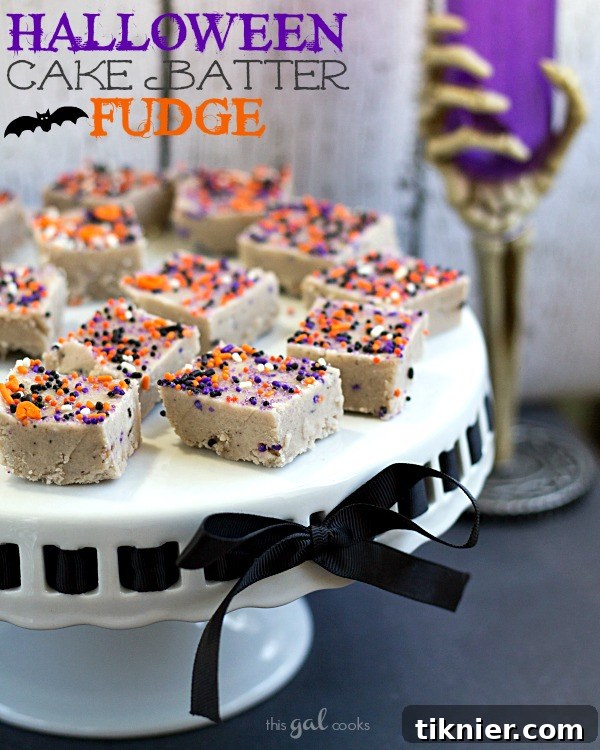 Trick-or-Treat Cake Batter Fudge 2 Rich and creamy Halloween Cake Batter Fudge, adorned with spooky fun Halloween sprinkles, perfect for festive celebrations.