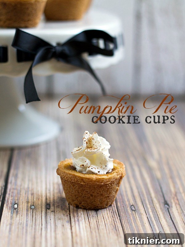 Stacked Pumpkin Pie Cookie Cups with whipped cream and a sprinkle of nutmeg