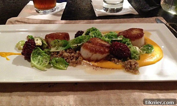 A beautiful birthday dinner spread including scallops, pickled blackberries, barley, squash, and Brussels sprouts cups.