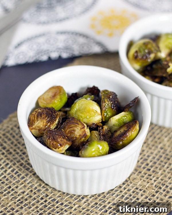 Perfectly roasted Brussels sprouts with crispy bacon, ready to serve as a delicious side dish.
