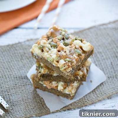 Delicious Pumpkin Spice Gooey Magic Bars, a perfect fall dessert with layers of pumpkin spice and gooey goodness, ideal for holiday treats.