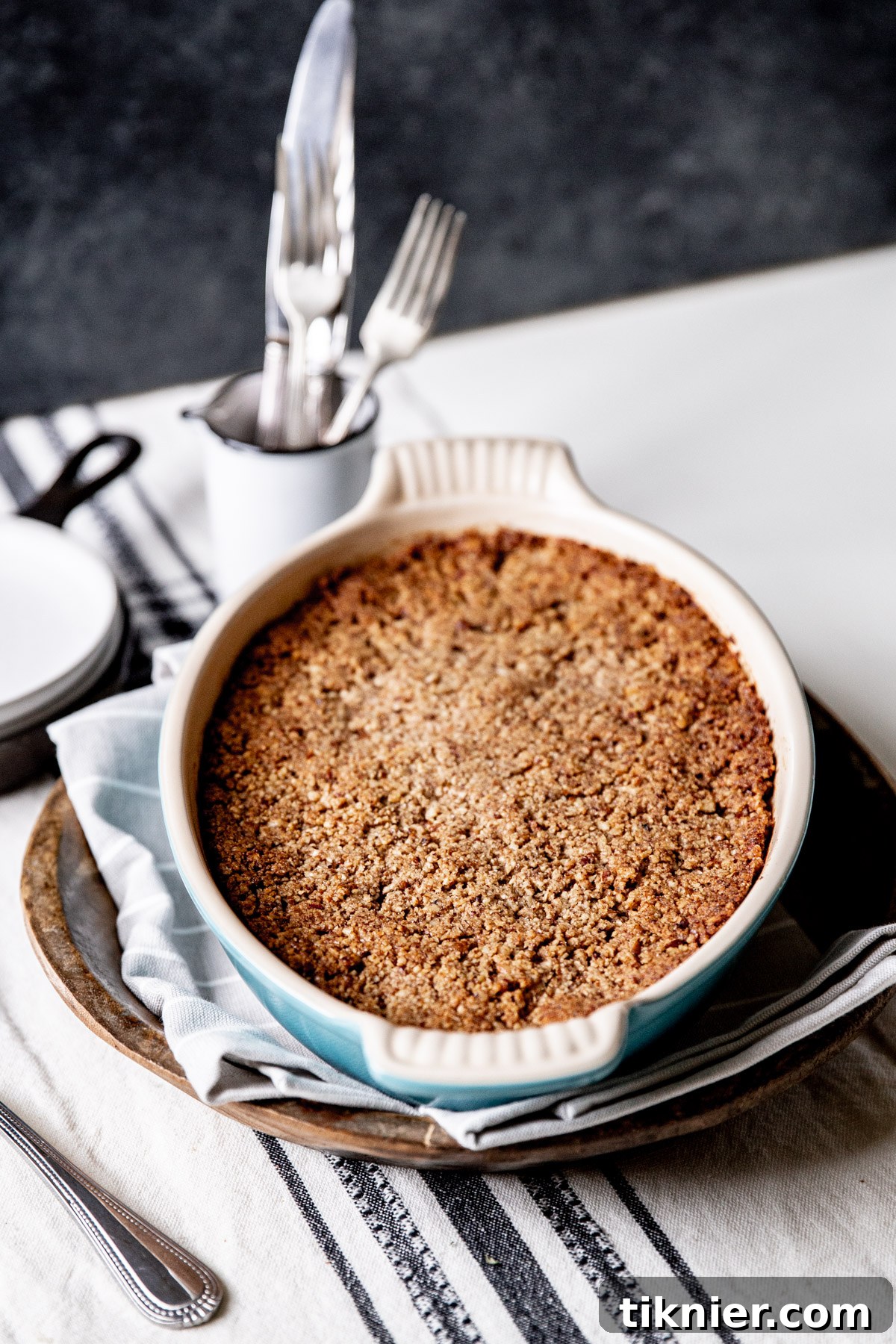 Individual serving of sweet potato casserole, showing the fluffy interior and crunchy streusel.