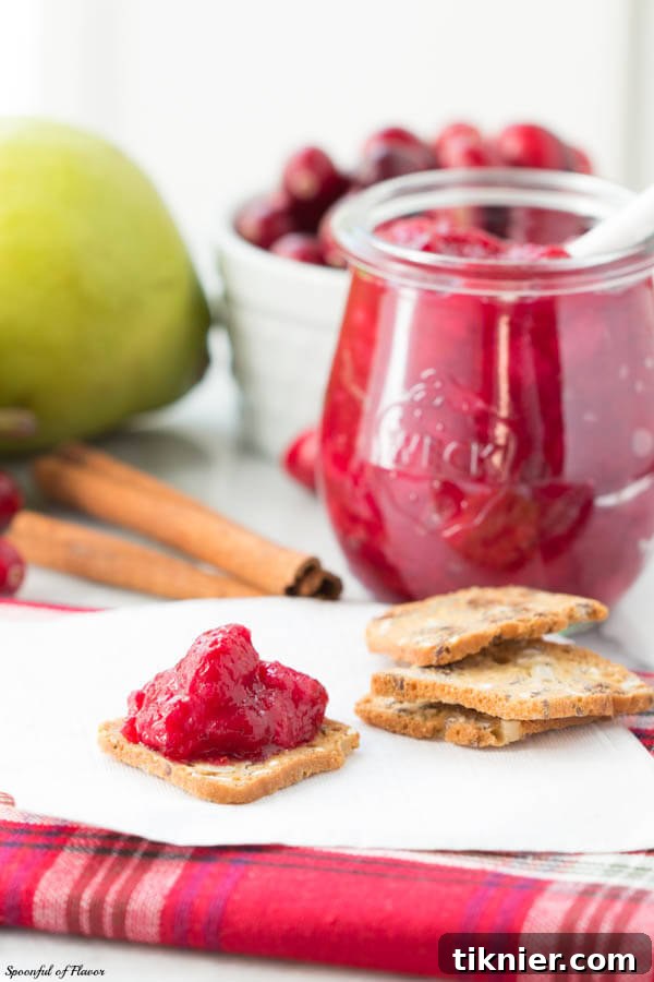 Homemade Cranberry Pear Chutney, a sweet and tangy holiday condiment that pairs well with cheeses.