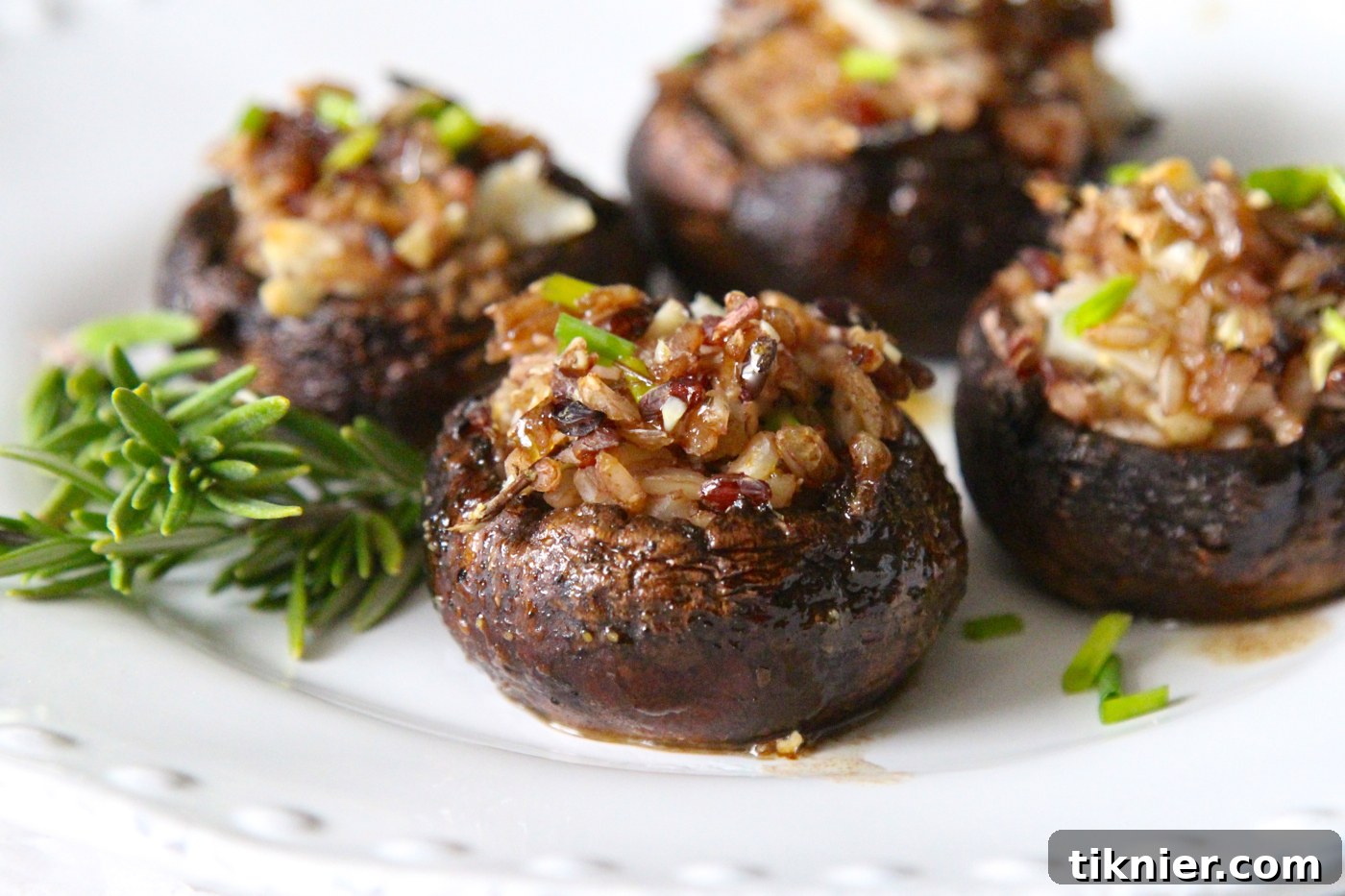 Flavorful Rosemary Infused Wild Rice Stuffed Mushrooms, perfect for vegetarians and holiday feasts.