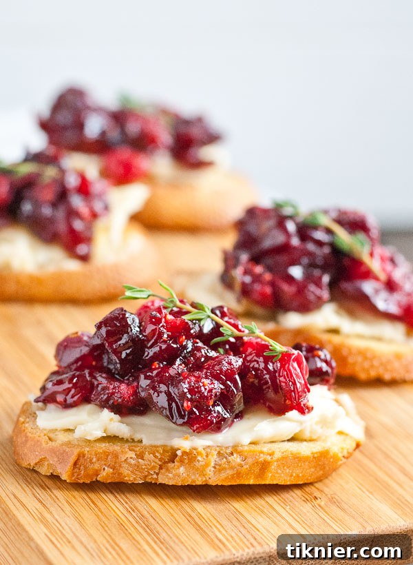 Sweet and savory Cranberry Brie Crostini, perfect for holiday gatherings and easy to make.