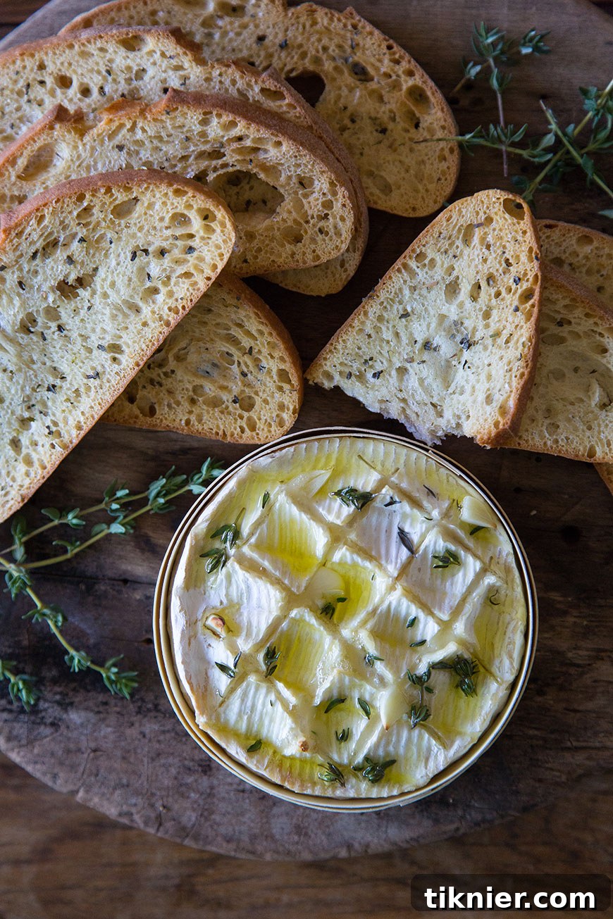 Rich Thyme Garlic Baked Camembert, an easy and impressive holiday starter.