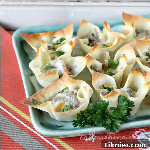 Flavorful Sausage & Cheese Cups, perfect for holiday entertaining and easy to eat.