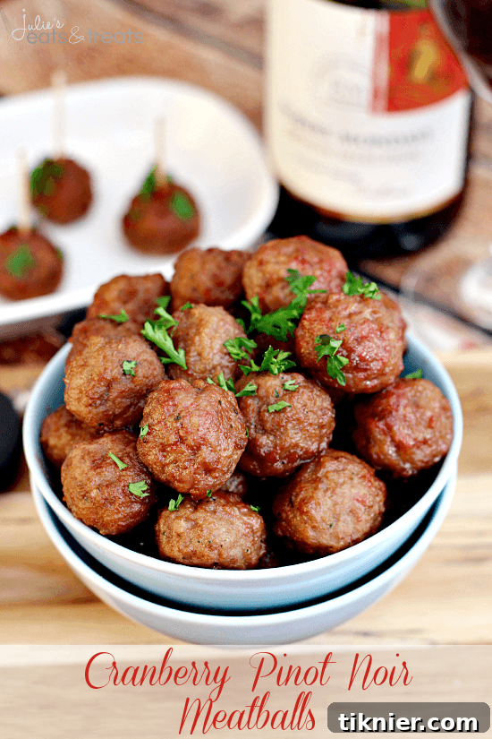 Sweet and savory Cranberry Pinot Noir Meatballs, a festive appetizer with a gourmet twist.