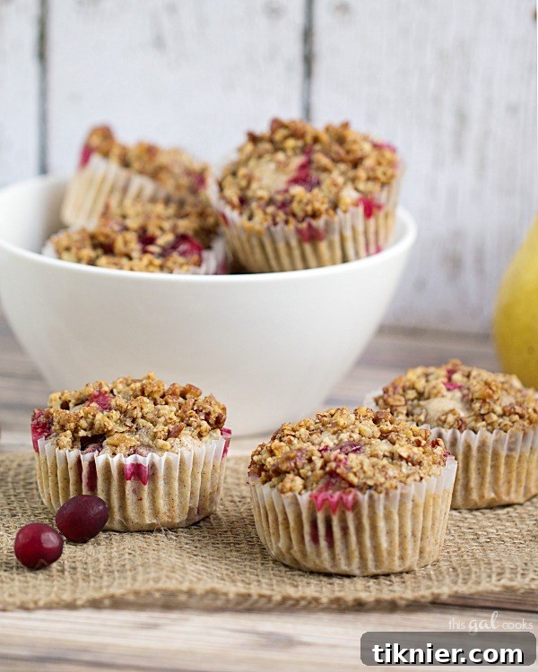 Warm Cranberry Muffins Cooling with Rum Pecan Streusel