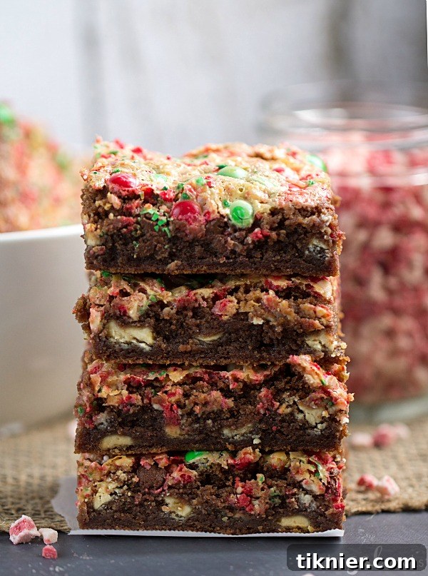 A close-up of Mocha Peppermint Cookie Bars, showing the vibrant toppings and gooey chocolate base